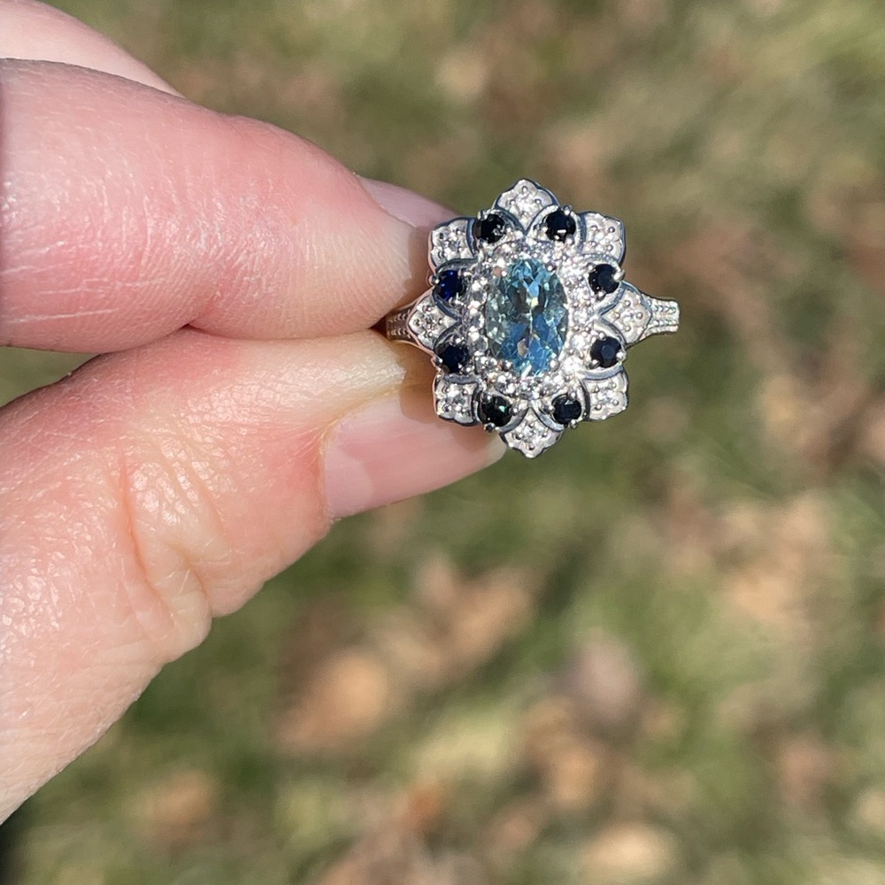 Mangoro aquamarine and blue sapphire floral ring